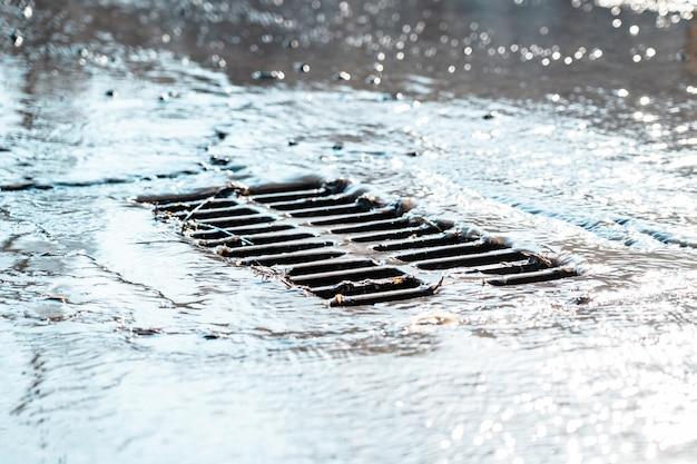 garage drain backs up when it rains