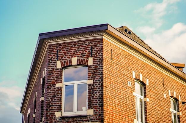 vinyl siding over brick