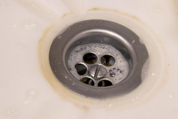 bathtub draining into kitchen sink