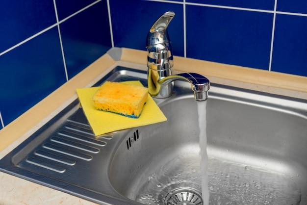 bathtub draining into kitchen sink